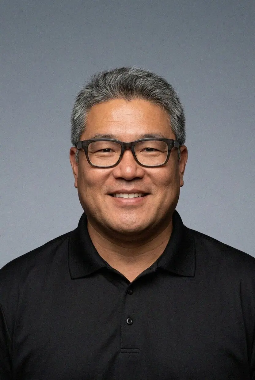 Kenji Okamoto, founder, outside the Torrance office on Hawthorne Boulevard